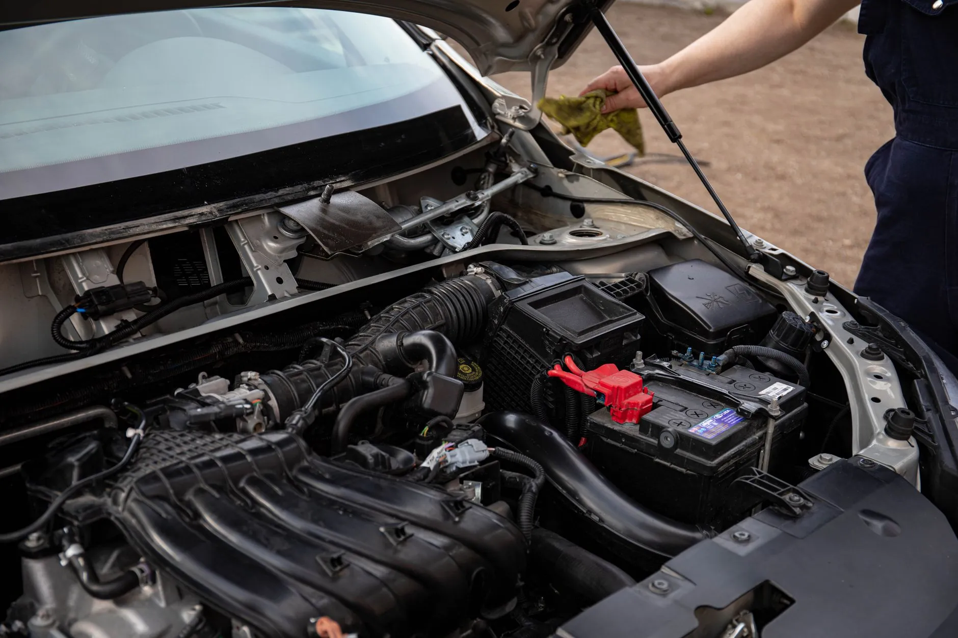 Testing a used car battery and charging system in the engine bay