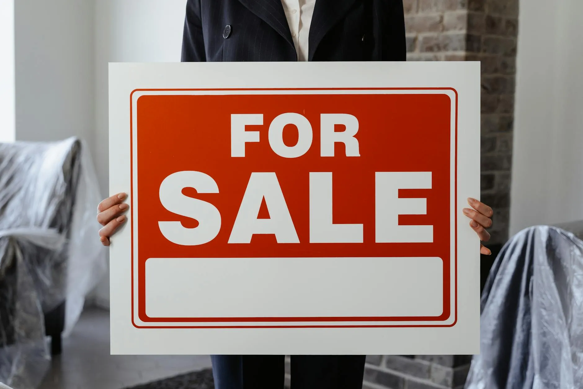Car with for sale sign in window