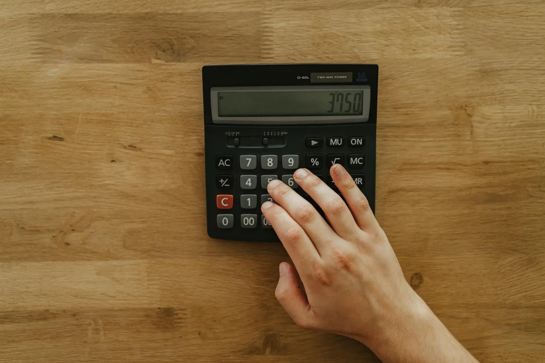 Calculator and car keys on desk