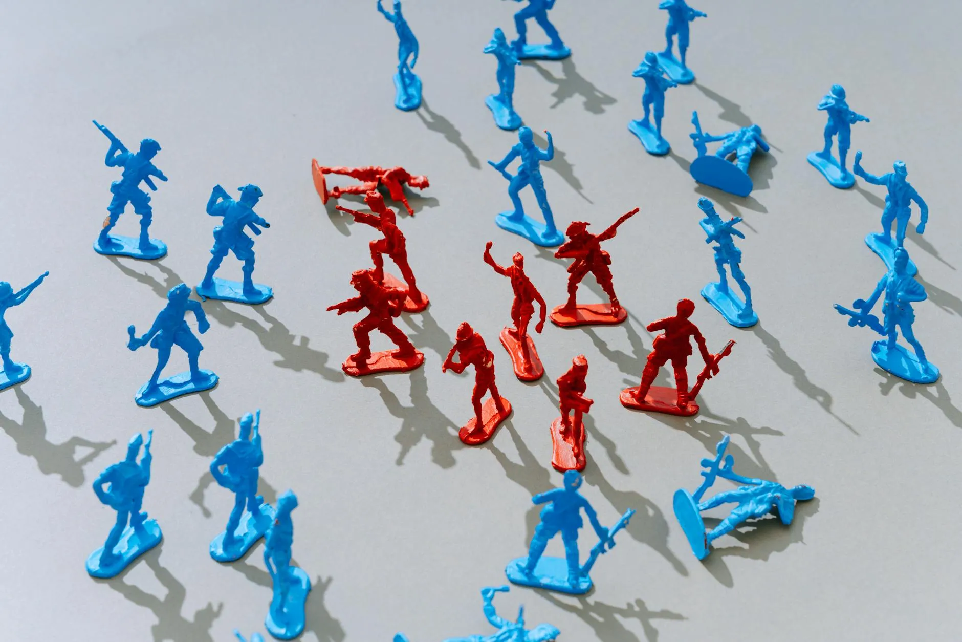 Red and blue toy soldiers in strategic battle