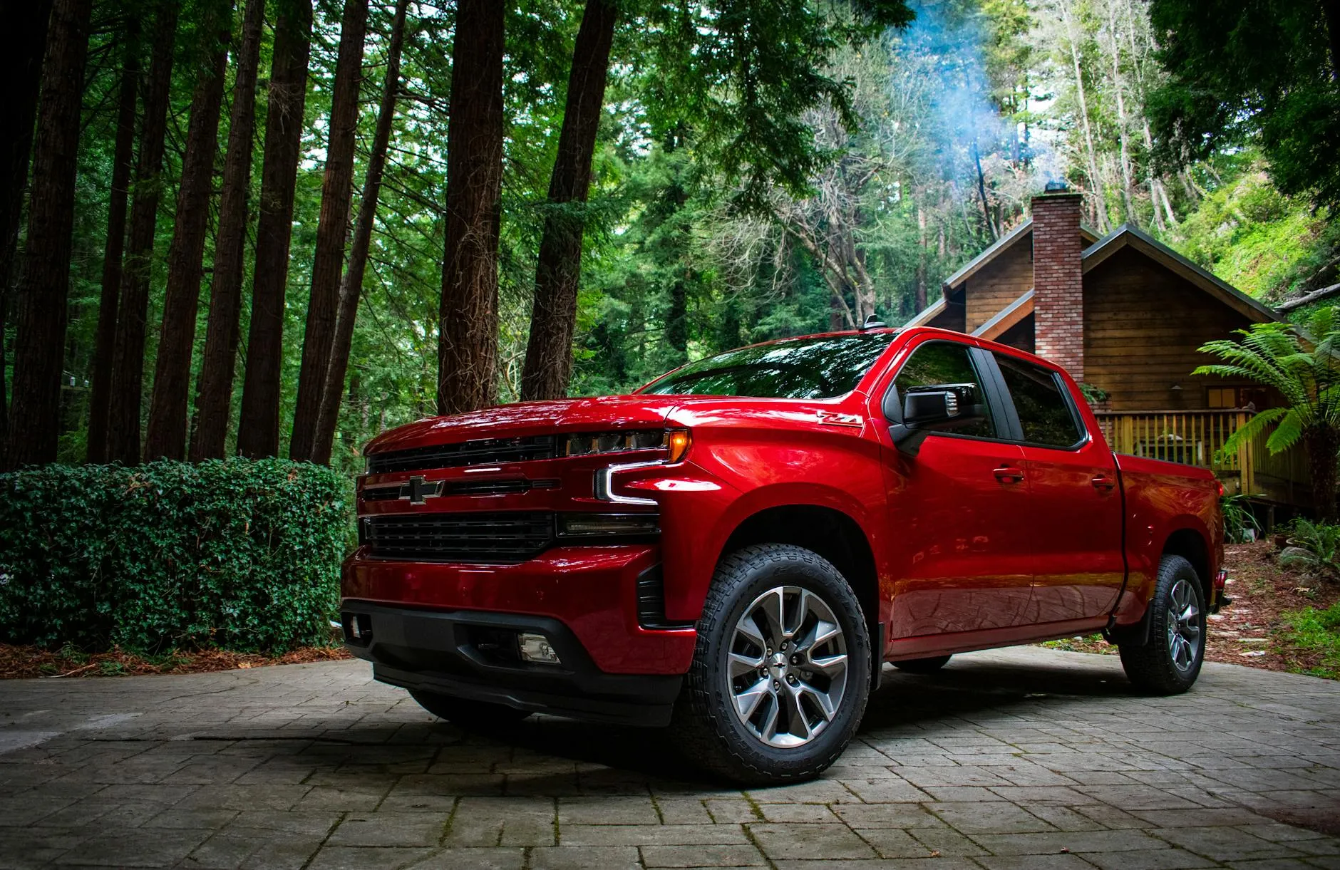 Red Chevrolet Silverado 1500 in driveway