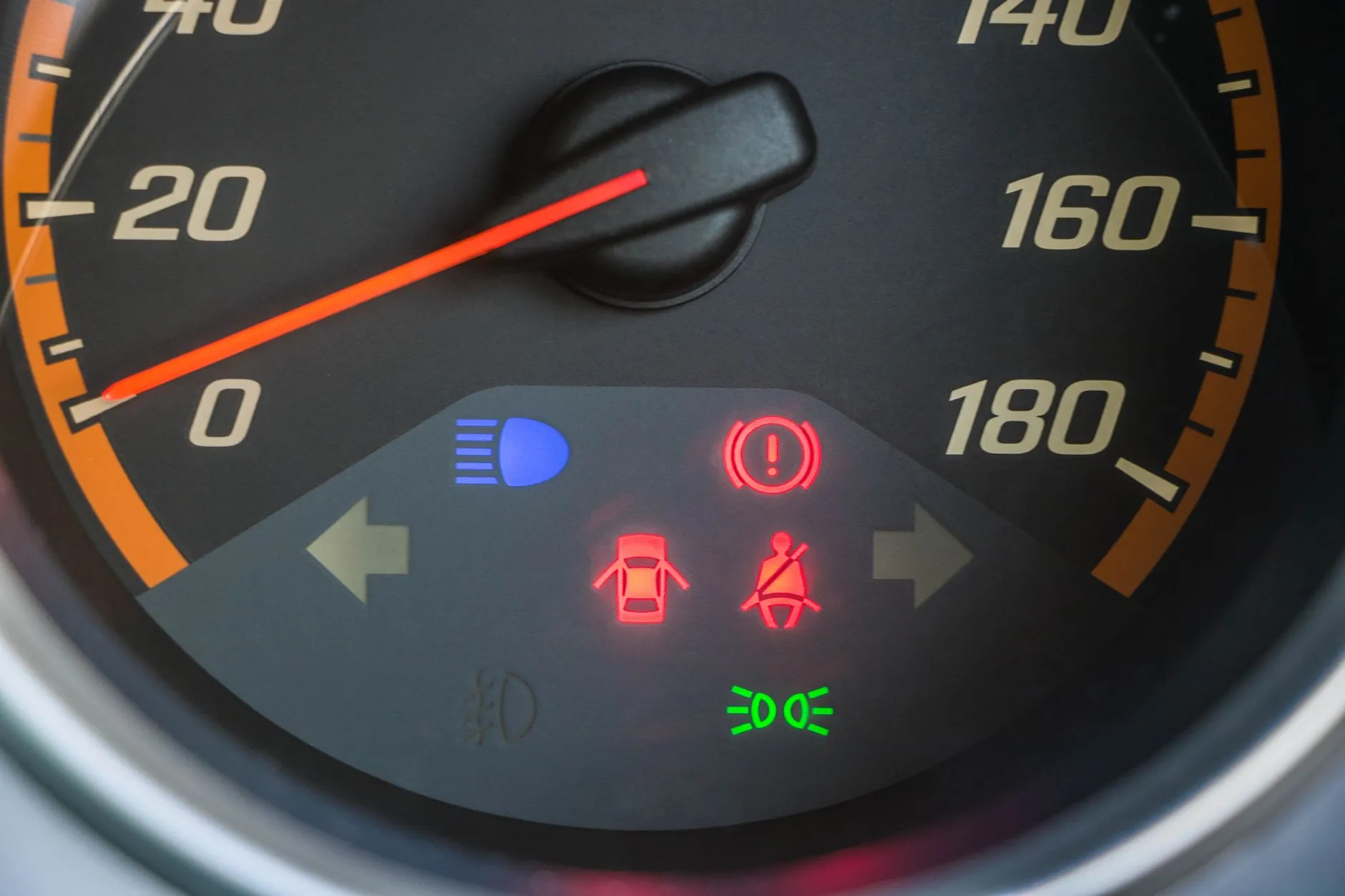 Illuminated dashboard warning lights on a used car during a pre-purchase check