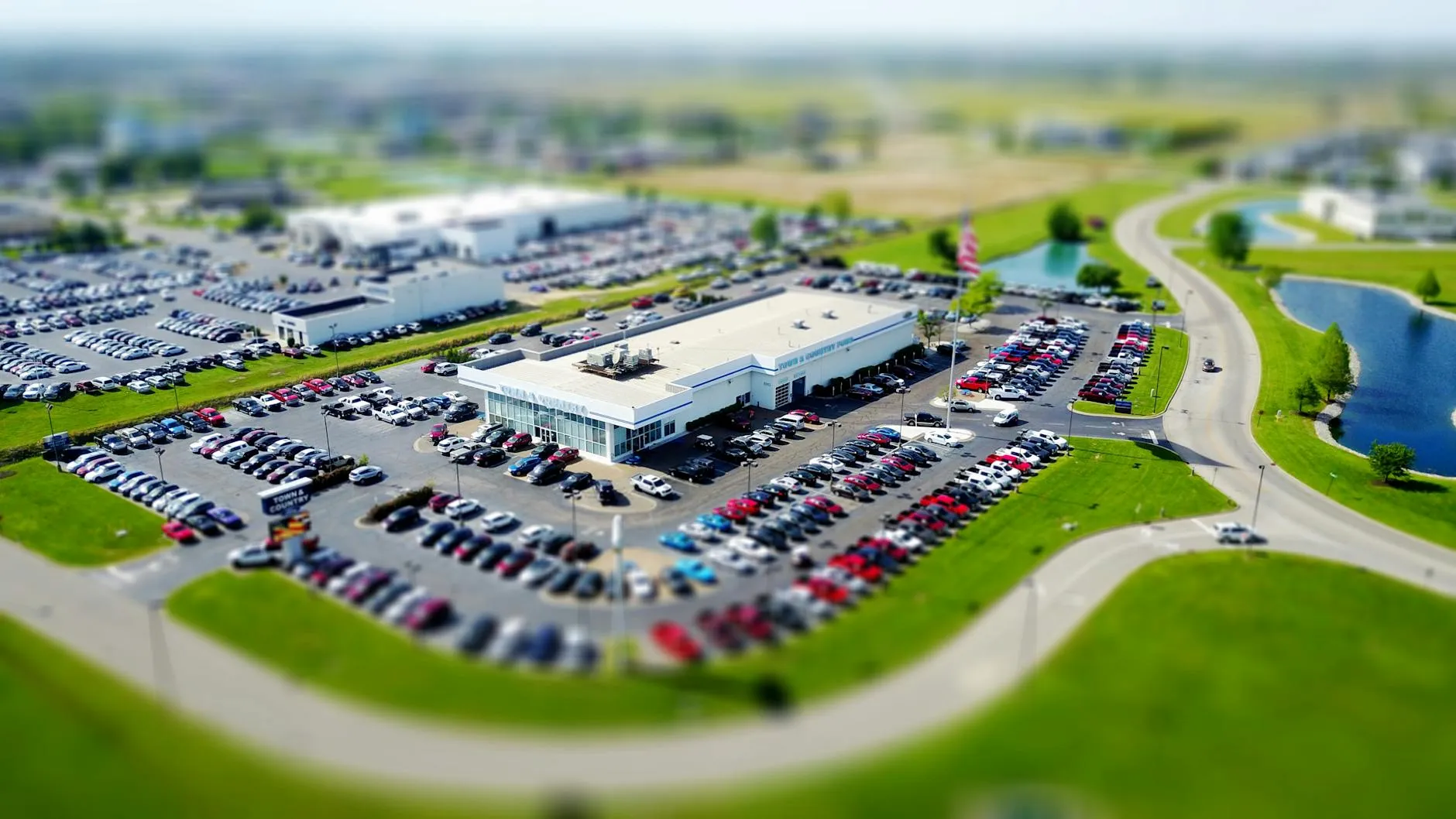 Car dealership with vehicles on lot