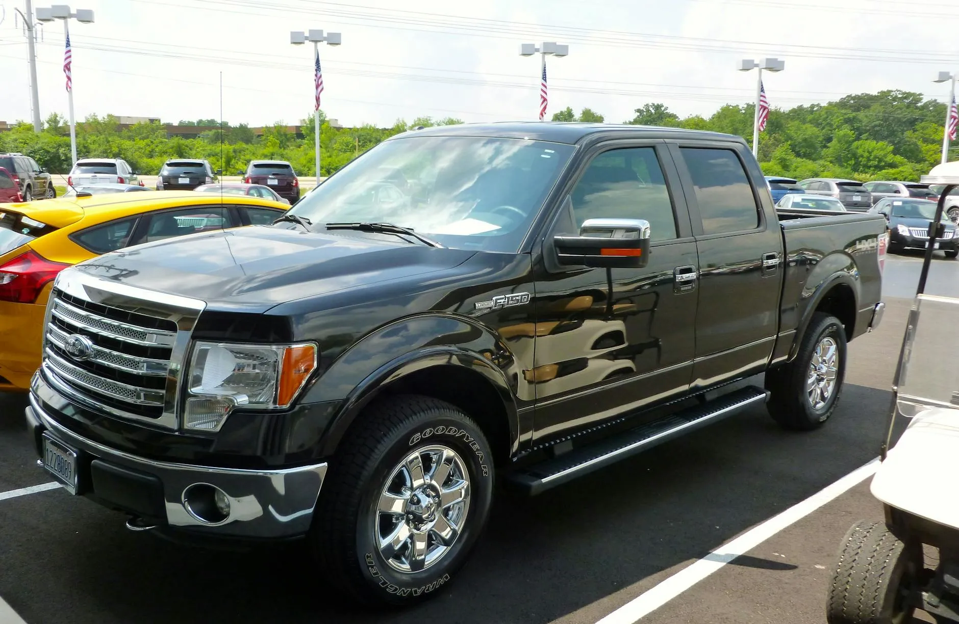 Black Ford F-150 pickup truck at dealership