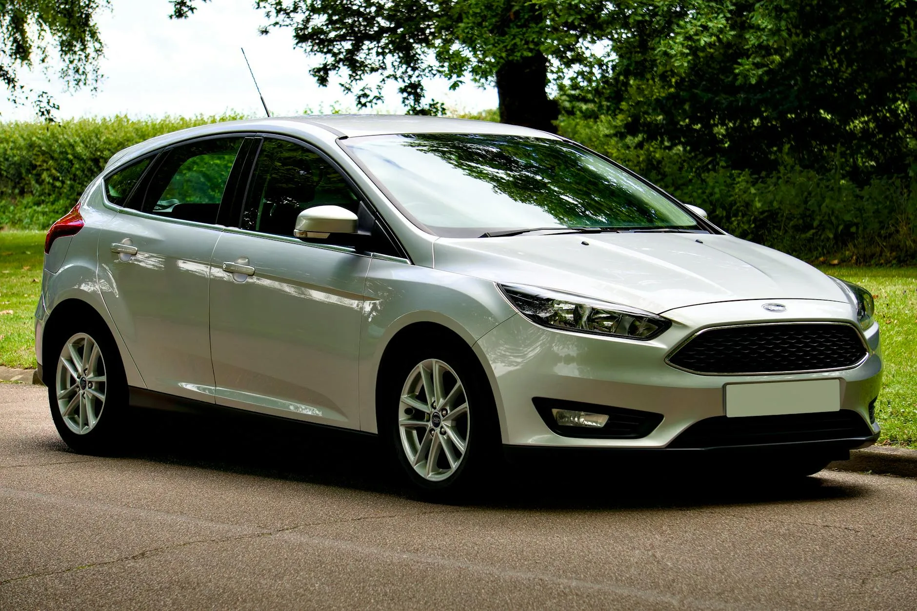 Silver Ford Focus hatchback parked on a sunny day
