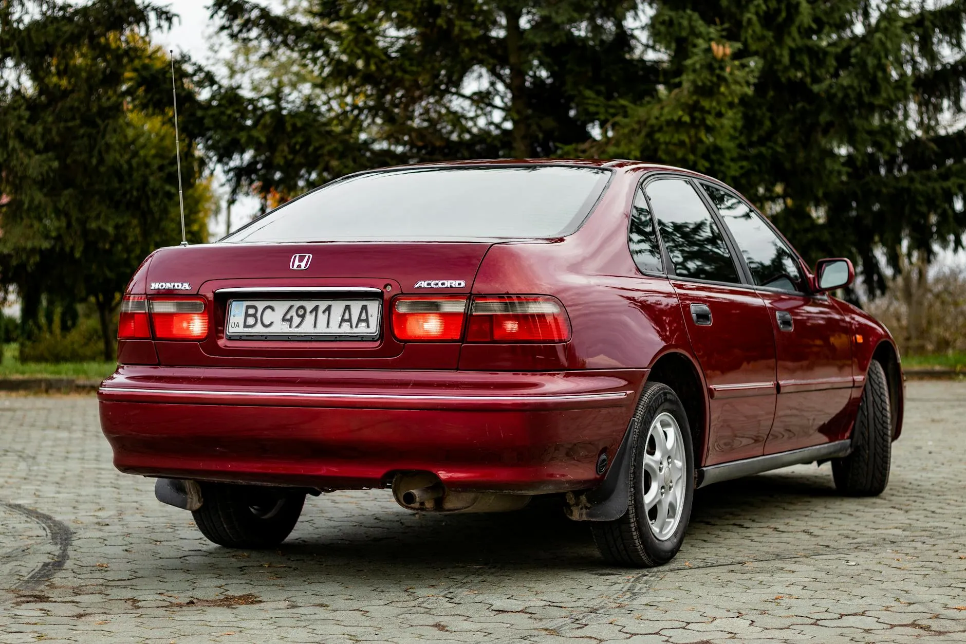 Red Honda Accord sedan parked outdoors
