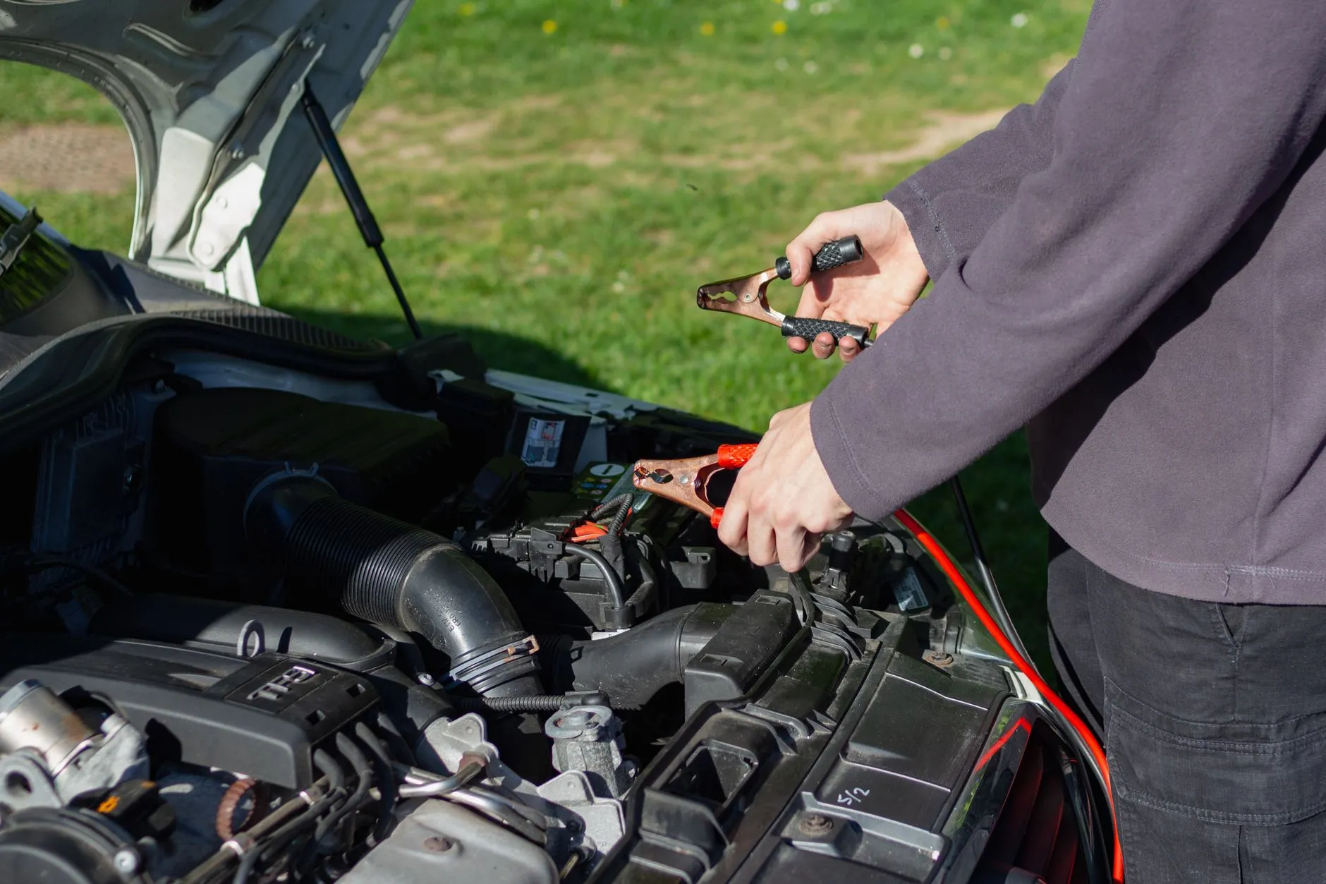 Jump starting a used car battery during a pre-purchase inspection