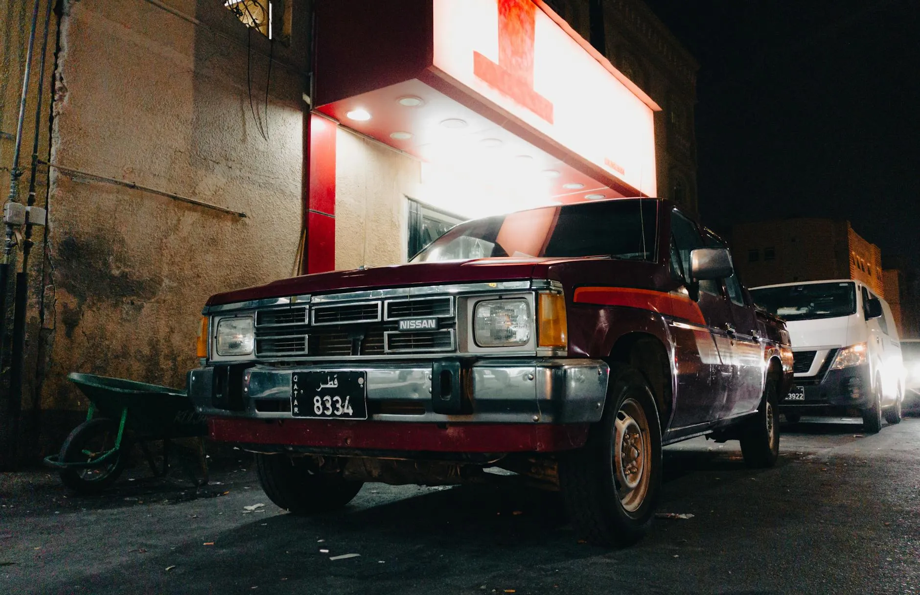 Nissan pickup truck parked at night