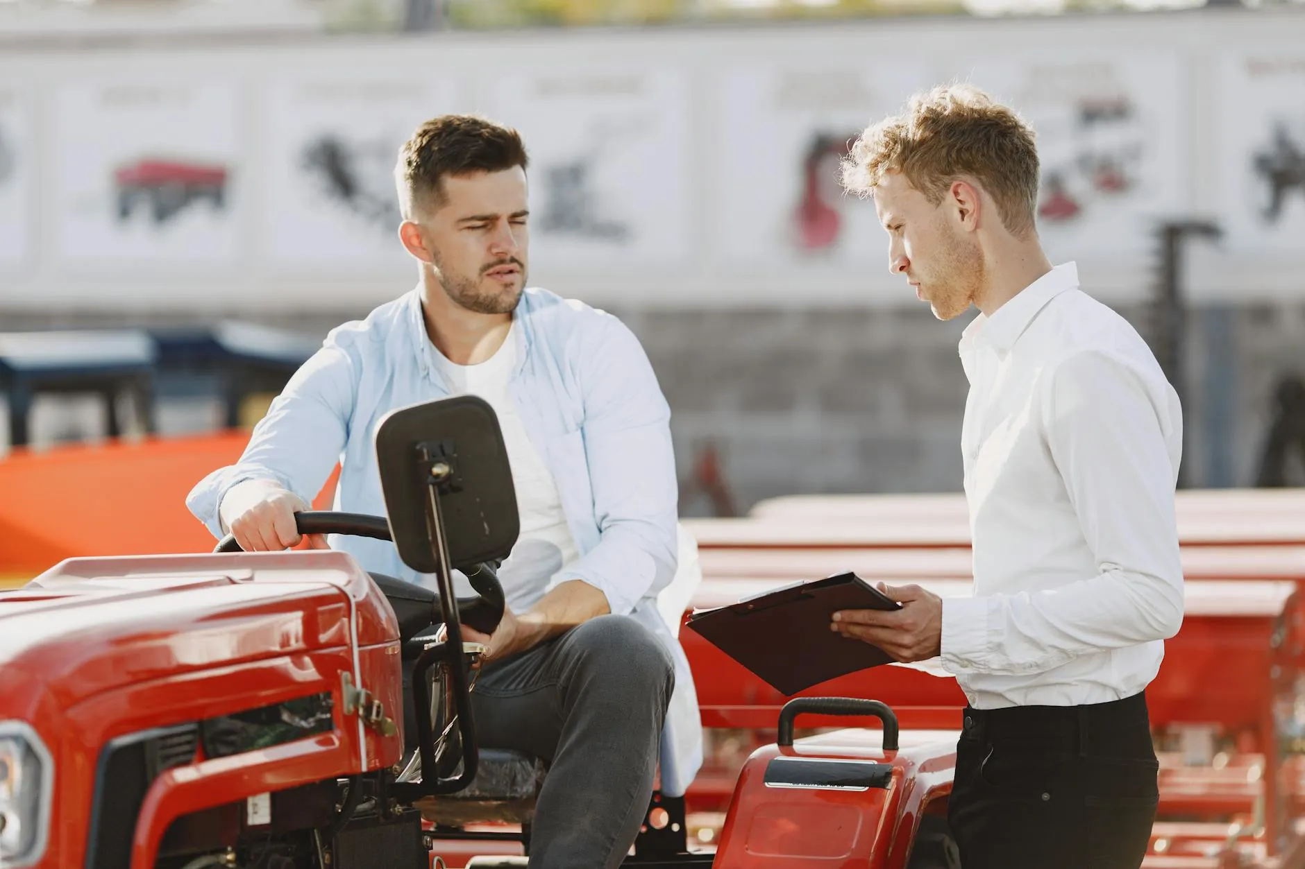 Two men discussing deal at dealership