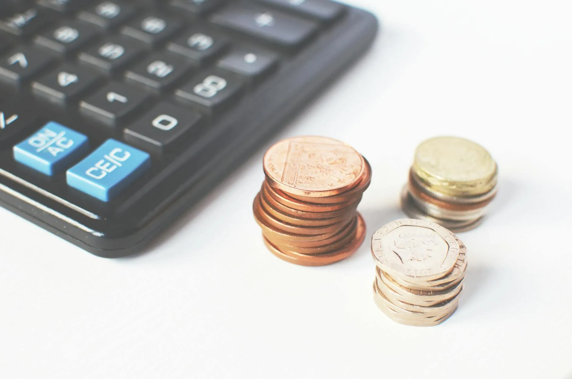 Calculator and money representing price comparison